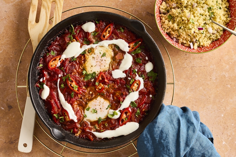 Get set for a taste of the eggs-otic with this North African-inspired baked egg dish! With wobbly golden yolks, poached to perfection in a bubbling paprika and chilli-laced tomato and red pepper sauce, a drizzle of Greek-style yogurt and a pile of herby couscous, the spicy brunch classic is reborn as a satisfying main meal.
