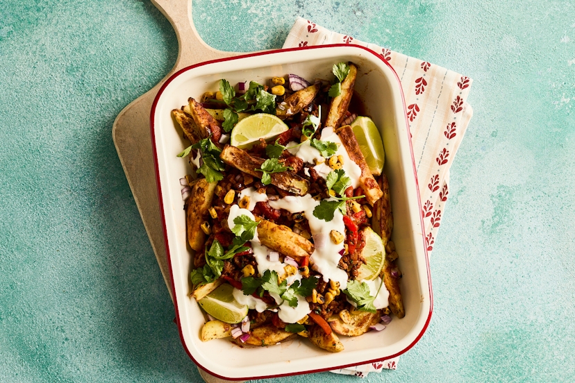 Meet your weekend plans. Perfect for popping in the middle of the table and helping yourselves, these crispy wedges are fully loaded with a simple beef chilli, diced red onion, creamy Greek-style yogurt, coriander leaves, a generous squeeze of lime and blackened corn.