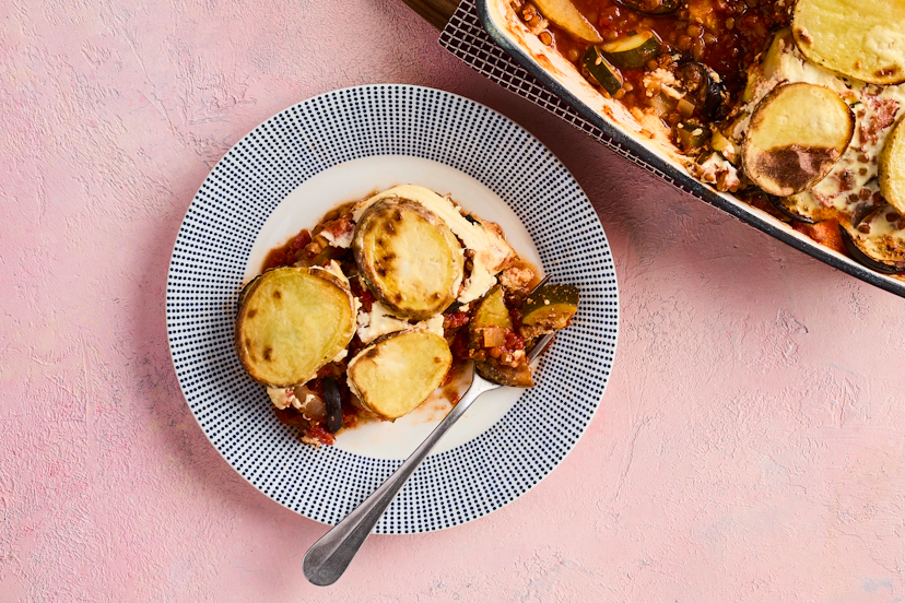 Each luxurious layer of this gorgeous vegetarian bake will take your taste buds on a Greek odyssey. Sink your serving spoon through crispy potatoes, soft aubergines, a lightened-up bechamel-style sauce, and cinnamon-spiced lentils, courgette and tomatoes with a hint of mint.