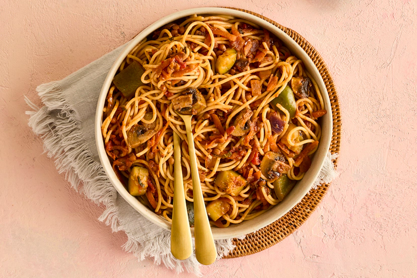 What a mouthful! No, we don’t mean the recipe title but the glorious meal itself… With (of course) lentils, chunks of courgette, green pepper, chestnut mushrooms and carrot, a garlic, basil and tomato sauce and piled-high pasta, this plant-based spag bol is rich, punchy and seriously satisfying.