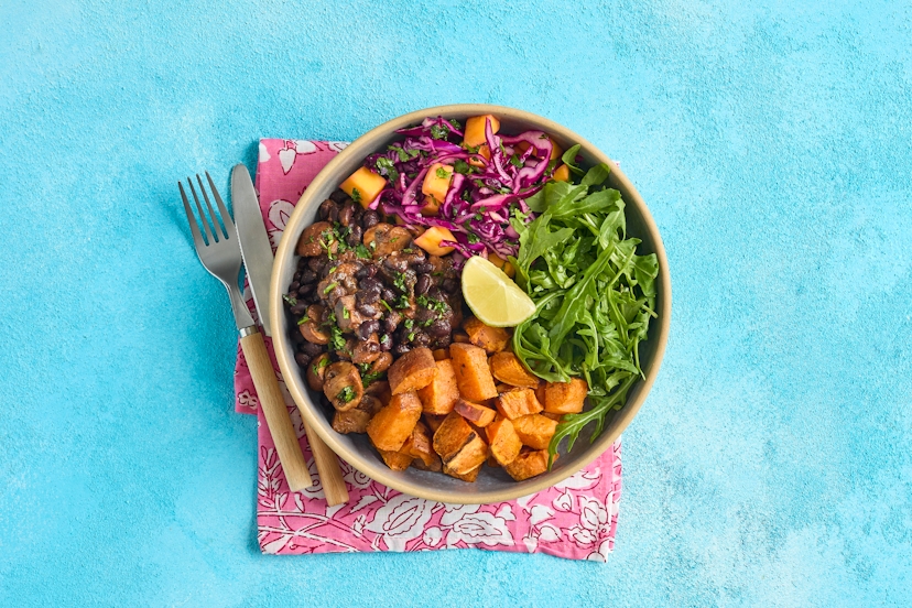 Prepare to be bowled over! Jamaica’s iconic jerk spice perks up roasted sweet potato and a tomatoey stew of chestnut and portobello mushrooms and black beans. The zesty mango slaw serves up some always-welcome sunshine, while peppery rocket brings a pop of green.