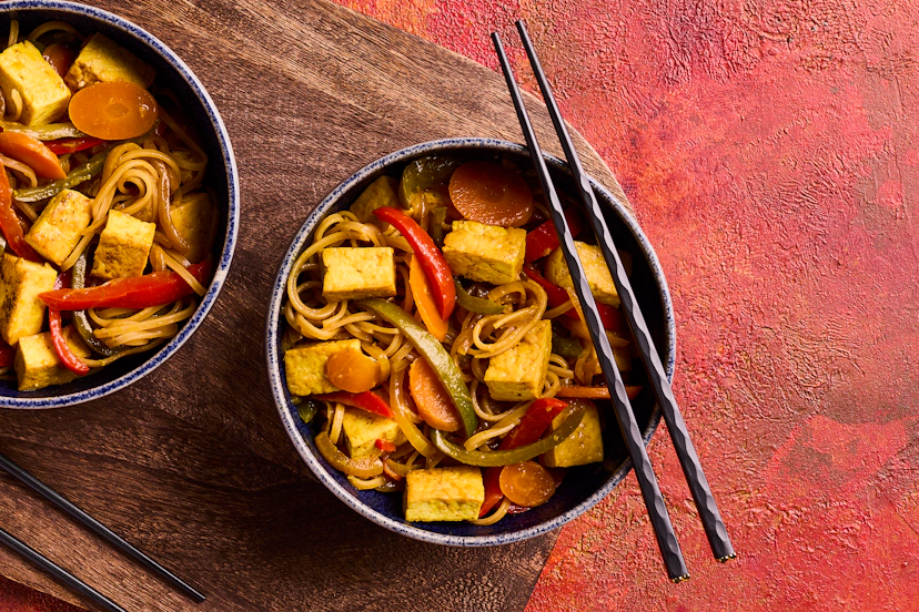 Versatile tofu is perfect in this vegan version of a takeout classic. It’s fried till crispy, mixed with red and green peppers, carrot and onion, and tossed through noodles so everything’s smothered in the mouth-watering ginger, garlic and tamari sauce.