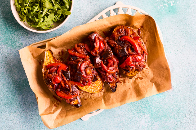 This dish ticks all the boxes – filling, super-tasty and easy to prepare. Oven-roasted sweet potatoes are topped with a lightly spiced, smoky aubergine and red pepper stew and finished with a sprinkle of rocket leaves.