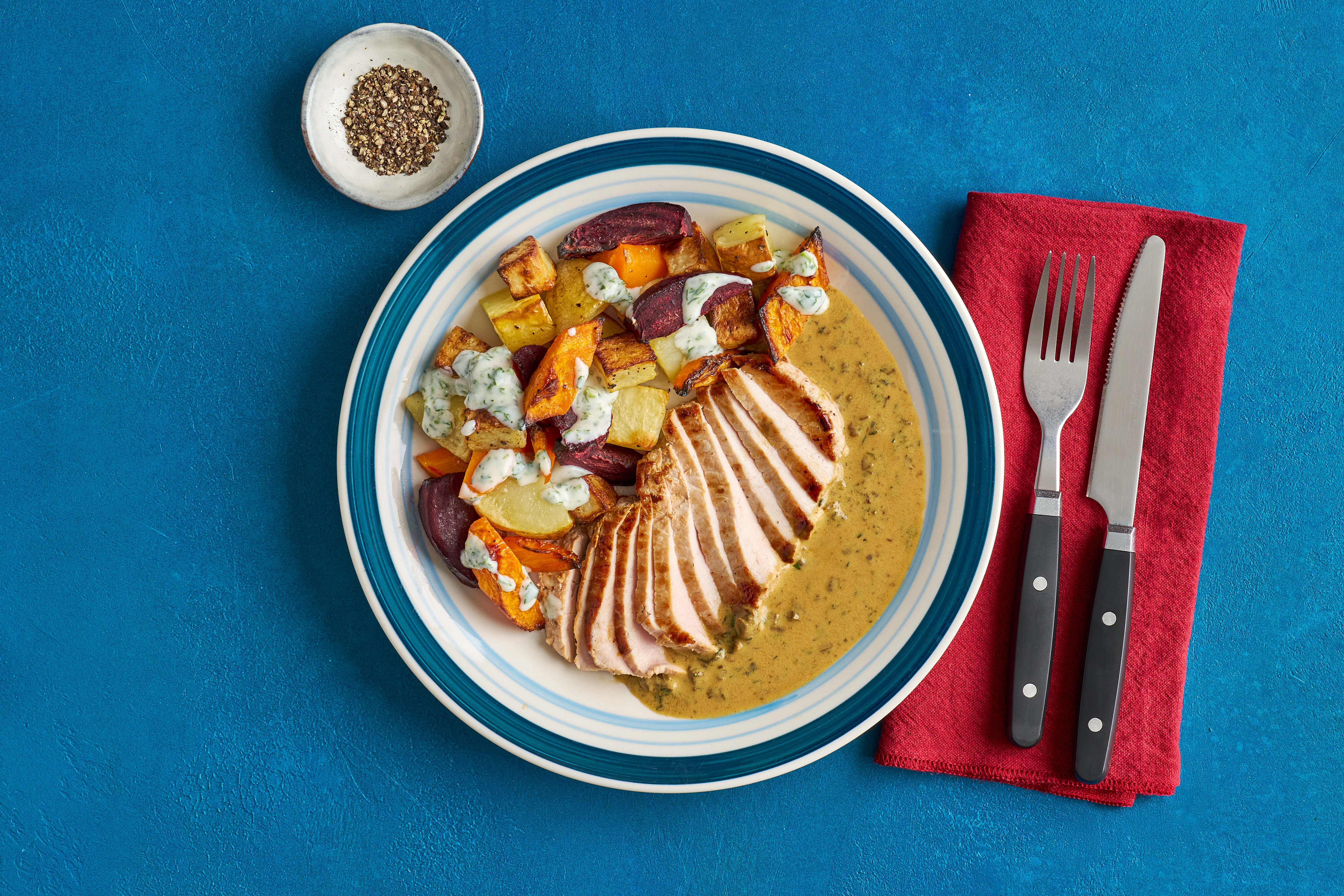 Garlic & herb pork with roasted root veg