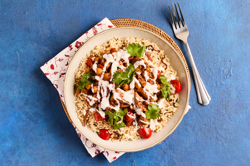 Versatile jackfruit is perfect for savoury dishes because it absorbs flavours beautifully. Here, it’s cooked in a rich, fragrantly spiced sauce that’s packed out with chickpeas, red pepper and tomatoes. Super-filling brown rice – flecked with caramelised onions, tomatoes and coriander – and dollops of Greek-style yogurt complete the feast.