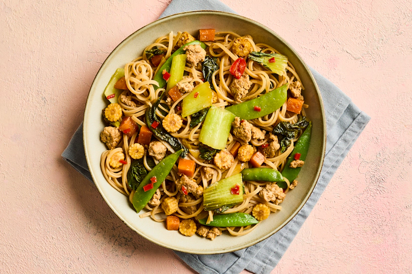 Based on a traditional Chinese dish zha jiang mian (also known as Chinese bolognese!), pork mince and noodles are stir-fried with spring onion, carrot, baby corn, pak choi and mangetout, and given oodles of zip with garlic, ginger, chilli and tamari. This midweek feast is ready in 25 minutes and cooks in one pan – what’s not to like?