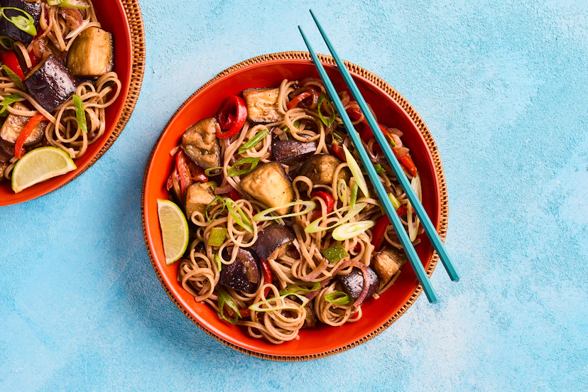 Aubergine is the perfect vehicle for wowzer flavours – in this case, aromatic Chinese five spice, ginger, garlic, tamari and (vegan) oyster sauce. Served up with pepper, spring onions, oodles of noodles and a zippy squeeze of lime, it brings just one word to mind: mmm!