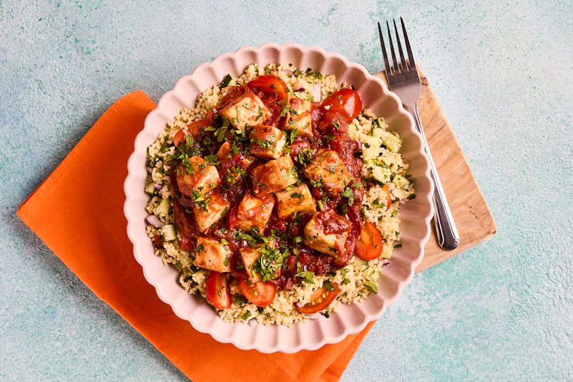 Tofu is just ace. Packed with protein (so it’s super-filling), it’s also perfect for soaking up flavourful sauces. Here, crispy cubes of tofu bask in a rich tomato sauce fragrant with exotic spices, complemented by couscous that’s packed with red onion, cucumber, tomato, mint and coriander.