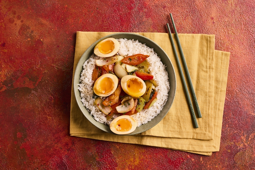 What makes this ‘drunken’, you ask? Maybe it’s because the heat from the chilli might make you reach for a cold beer! Our take on the cult Thai dish features sizzling onion, pepper and pak choi, sprinkled with five-spice, chilli, coriander, ginger and garlic. It’s served with fluffy rice and topped with marinated eggs. Cheers to that!