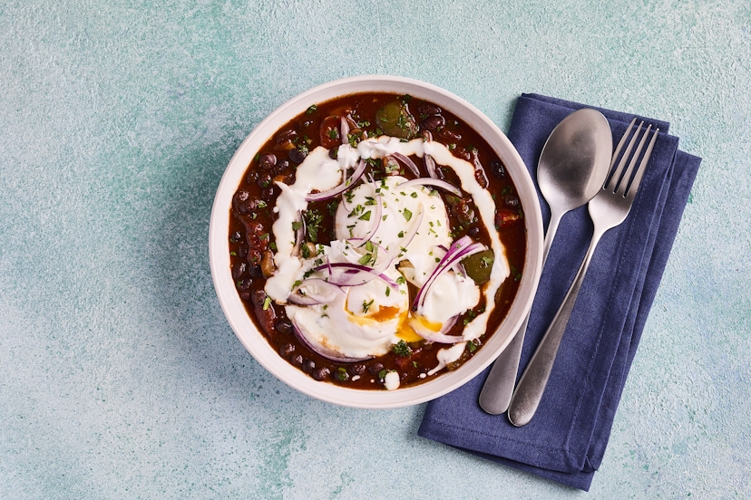 Like shakshuka? You'll love our warming Tex-Mex stew with black beans for extra filling power. They’re simmered with carrot, green pepper and onion in a spicy tomato sauce, and finished with gently poached eggs, sprinkled with parsley and fresh onion and a drizzle of yogurt. Delicious any time of the day!