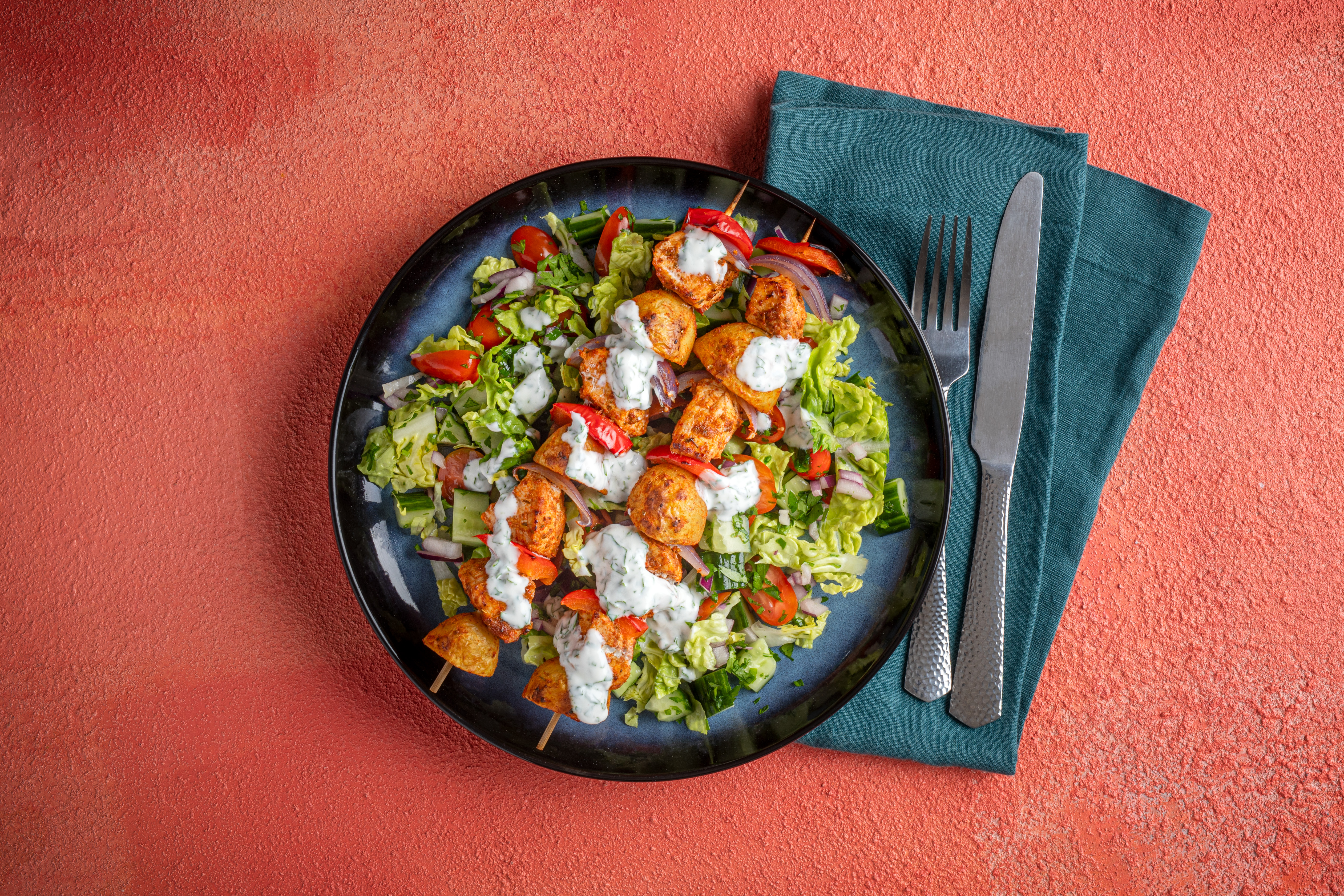 Loaded pork kebabs with little gem salad
