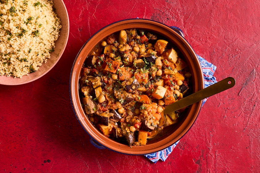 Preserved lemons are an authentic part of North African cooking, and they bring a bright burst of flavour to this tagine. Roasted aubergine, carrots and butternut squash are stirred into a tomato sauce with preserved lemon and chickpeas, spiced with Moroccan seasoning, and served with minty couscous.