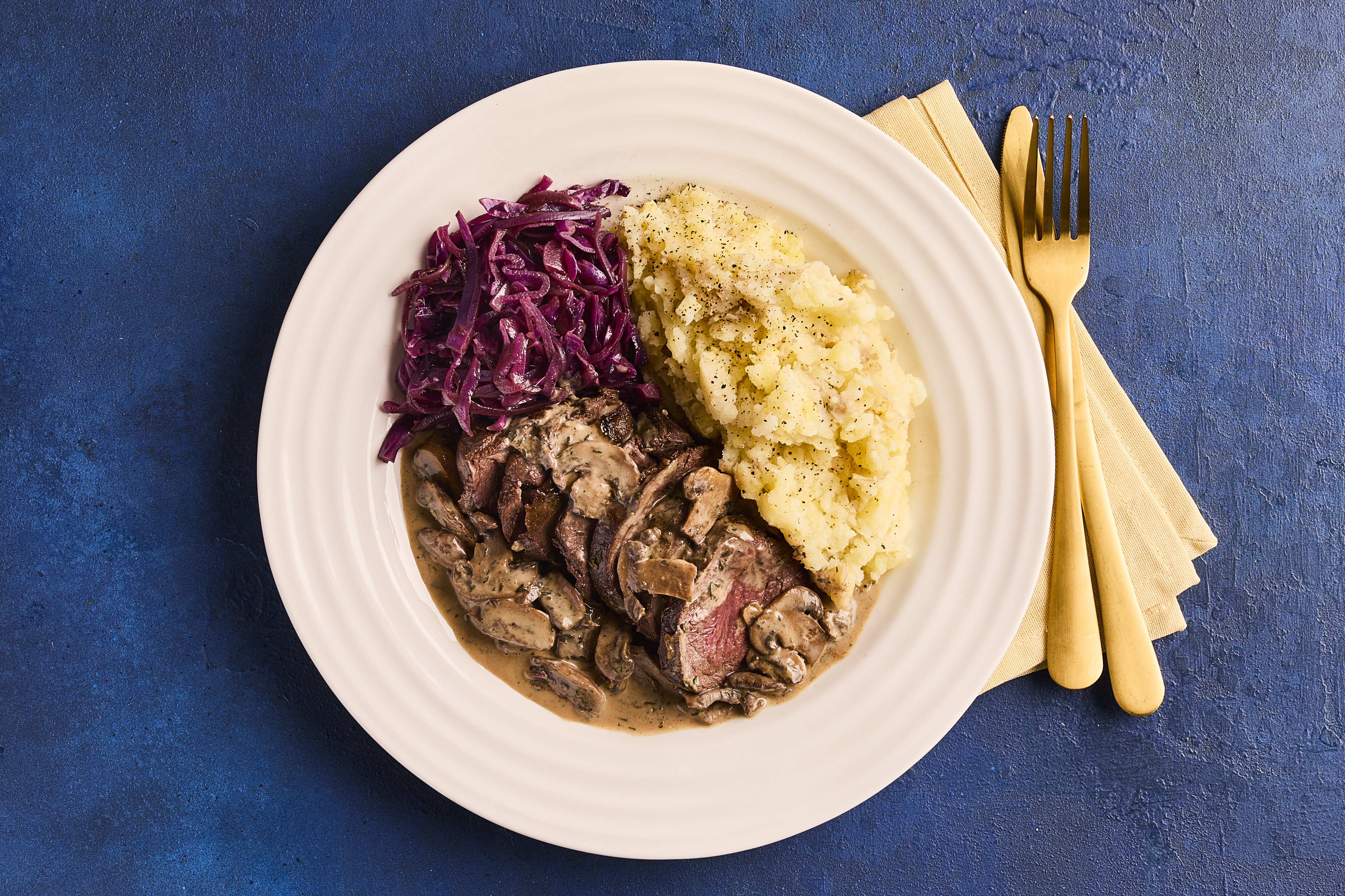 Venison with red cabbage & mushroom sauce