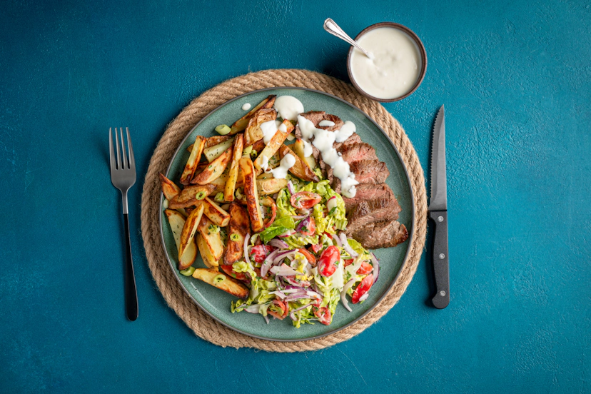Our zippy horseradish dressing takes steak and chips to a new level. Flash-fried bavette steak (the connoisseur’s choice!) is served with skinny fries sprinkled with thyme and spring onion, and a crunchy fresh salad. Just one word – delish!