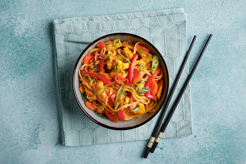 All aboard the express service to South East Asia! A zingy blend of ginger, garlic, soy and curry powder creates a warming curry sauce in this takeout classic. Stir in chunks of chicken, pepper and onion, plus noodles to soak up those flavours, and you’ve got a filling fakeaway that’s totally transporting!