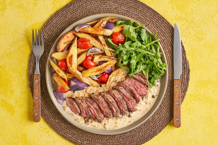 Nothing says ‘date nightʼ like a juicy steak and pile of chips. Add roasted onions and baby tomatoes, peppery rocket and a dreamy, creamy sauce made with green peppercorns, shallot and garlic, and suddenly things are looking very promising indeed. Letʼs get it on... the plate!
