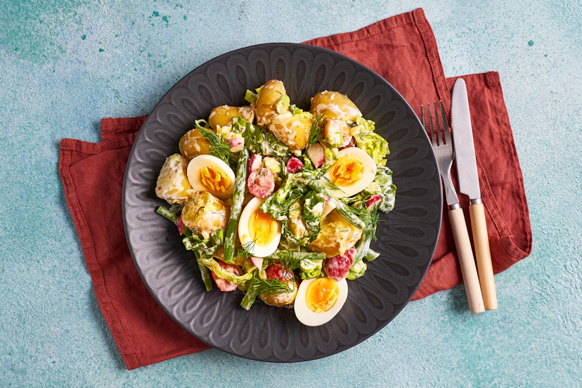 Get set for a fabulously filling and flavoursome summer salad! Baby potatoes, green beans, radishes, spring onions, lettuce and baby tomatoes are tossed with chopped dill, apple cider vinegar, chilli flakes and Greek-style yogurt, then topped with boiled eggs. Dill-ightful.