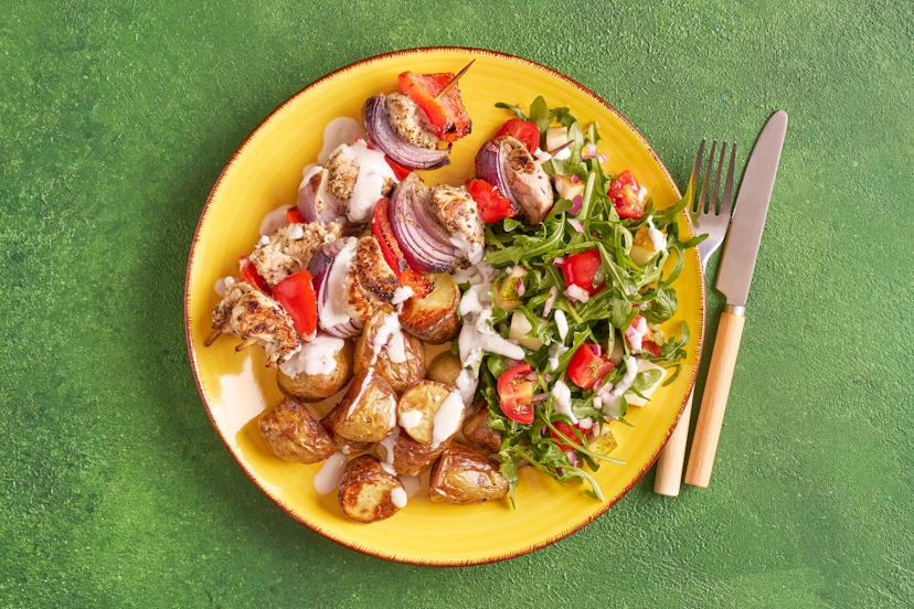 Fresh, fruity and full of flavour, this summery dish is a doddle to make. Onion, red pepper and turkey skewers scented with oregano team up with baby roast potatoes and a rocket, tomato and pear salad with a zesty lemon dressing. It’s finished with a delicious drizzle of garlicky yogurt.