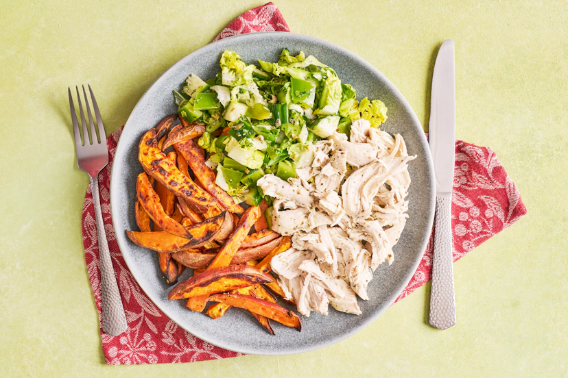 Gorgeously garlicky chicken breasts (foil-baked to preserve their juiciness), sweet potato fries and a crisp green salad... welcome to summer on a plate. Our chefs have really upped the ante with that side salad – mixing in coriander, mint, chilli and capers shows gem lettuce the time of its life!