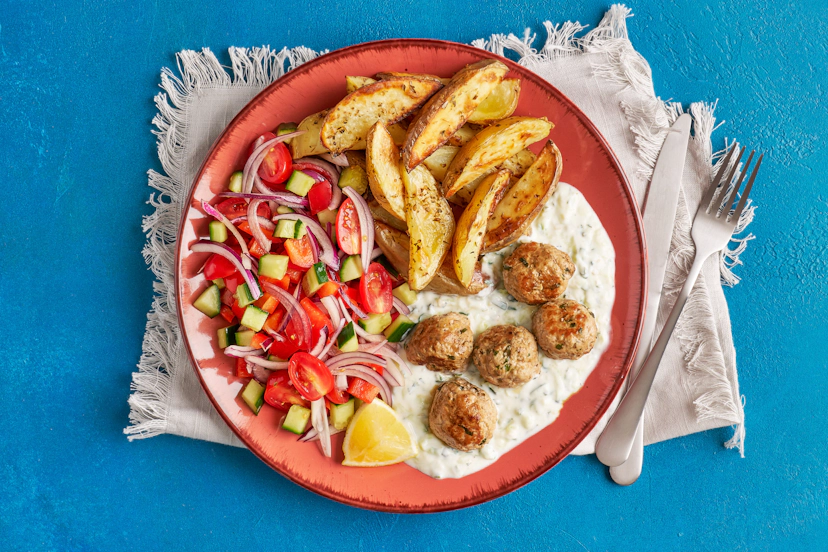 We’ve given pork meatballs an Aegean glow-up by mixing in oregano, mint and garlic and plating them up on a cucumber and mint-infused yogurt sauce, served alongside herby potato wedges and a colourful lemon-kissed salad. Ready? Then let’s get meze!