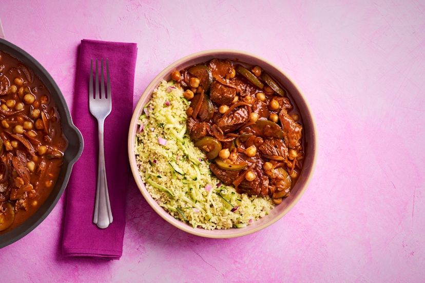 Tagines normally take their sweet time, but thanks to easy-squeezy harissa and ginger & garlic pastes, and a ready-blended spice mix, this North African-style feast is on the table in just 20 mins. Tender bavette steak keeps the simmer time short, while chickpeas and onion and courgette-packed couscous soak up all that rich, fragrant flavour.
