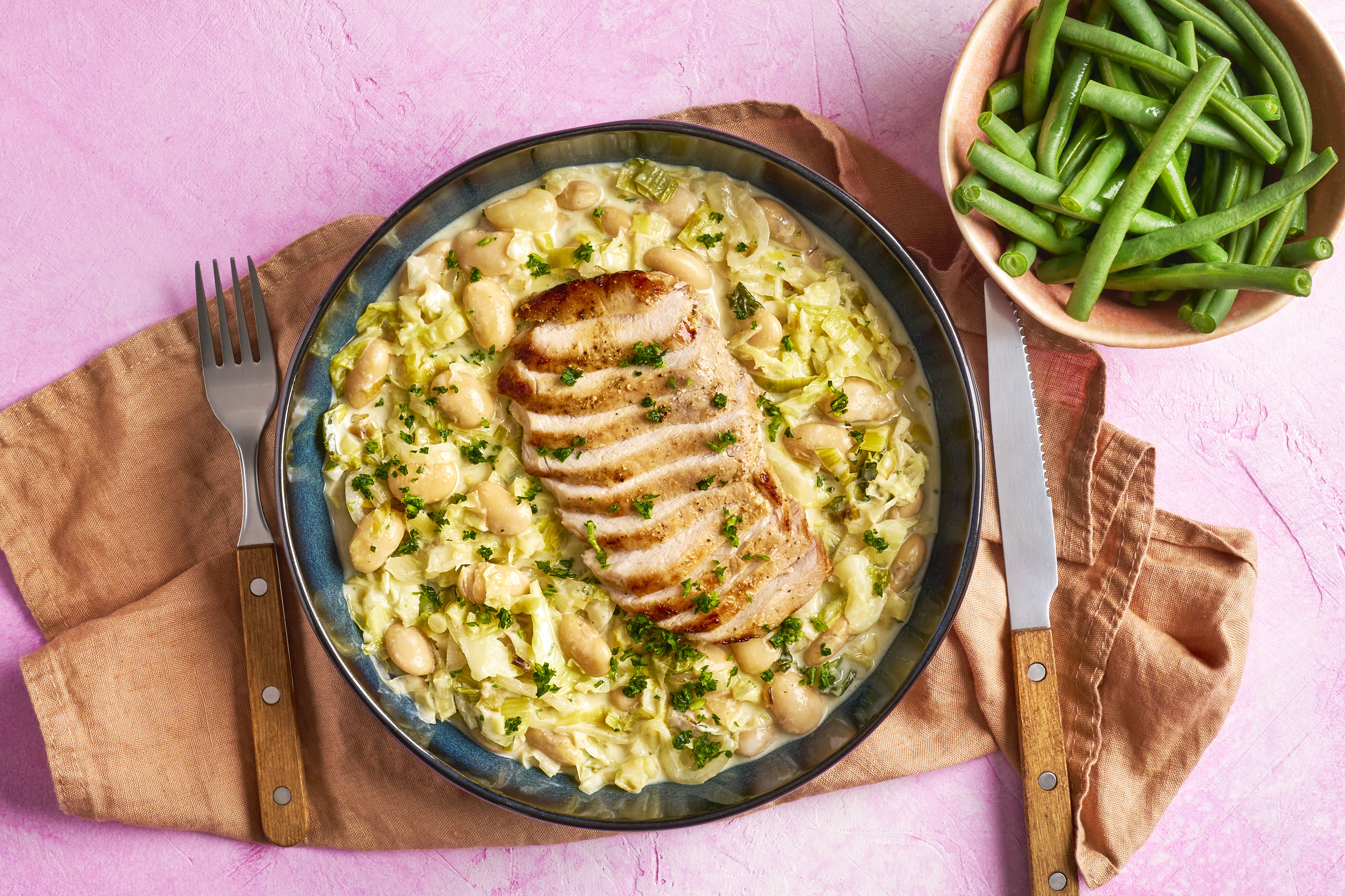 Pork medallions with creamed cabbage & beans