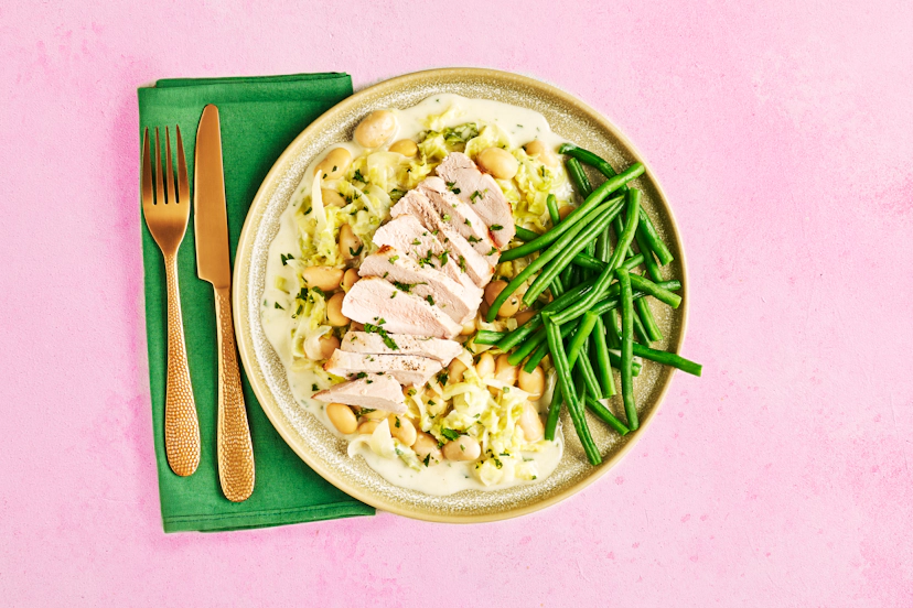 Juicy slices of grilled pork on a bed of creamy cabbage and leeks is a dreamy dinner combination. Just add butter beans for filling power and crisp green beans for crunch and you won’t want it to end…