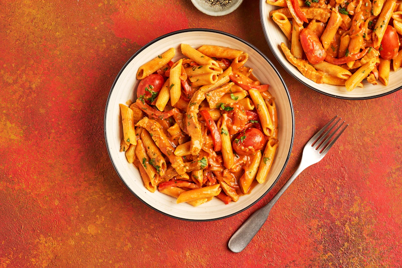 Call off the search, we’ve tracked down your new favourite dinner! This cosy, smoky, satisfying feast of sizzled pork strips, peppers, baby tomatoes and penne – all smothered in a tangy tomato sauce made creamy with Greek-style yogurt – is guaranteed to hit the spot.