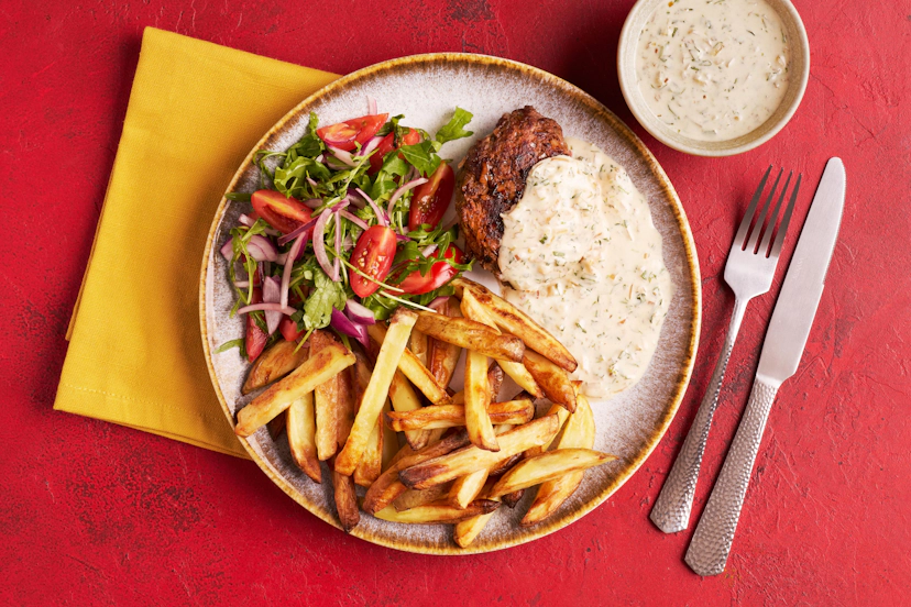 This French classic isn’t actually steak at all. Think more burger and chips, but if they’d been to finishing school and come home with a sexy accent! Our minced beef patties are packed with shallot, thyme, tarragon and Dijon mustard. Sizzle them in the pan and serve with a lightened-up béarnaise sauce, skinny pommes frites and a red onion, tomato and rocket salad.