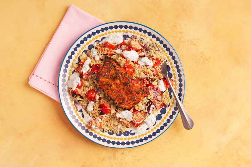 Chermoula is a vibrant North African marinade, buzzing with coriander, chilli, garlic, cumin, smoked paprika and lemon – and it’s perfect with salmon. Beneath is a bed of satisfying couscous studded with red onion, baby tomatoes and charred red peppers. Drizzle with cooling yogurt and it’s glowier than a Saharan sunset!