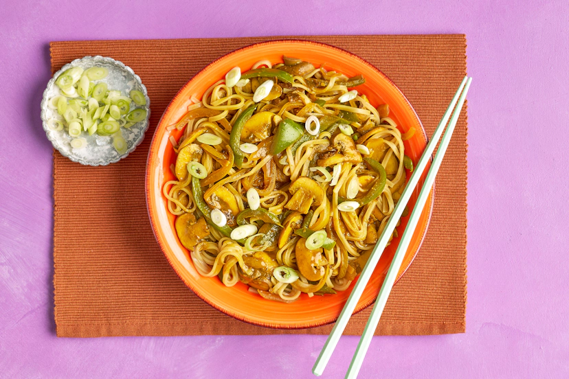 A zingy blend of ginger, garlic, tamari and curry powder creates a punchy medium-hot sauce in this takeout classic. Stir in porcini and chestnut mushrooms, green peppers and onions, plus rice noodles to soak up those flavours and a garnish of spring onions, and you’ve got a filling fakeaway that’ll transport your taste buds to South East Asia.