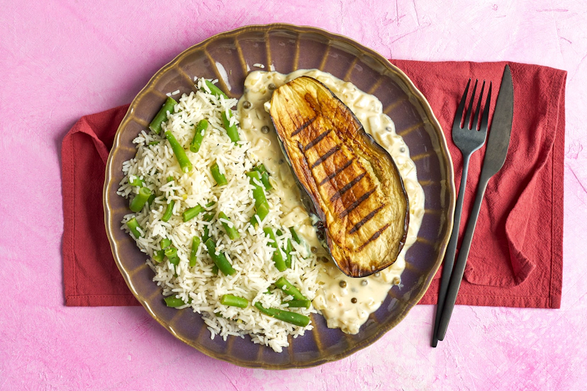 Aubergine and miso are a cult combo – and this dish shows you why. Griddling then roasting the aubergines coaxes out a nutty, mildly sweet flavour, with a velvety texture and caramelised edges. A creamy miso and green peppercorn sauce ups the umami ante perfectly, while herby, lemony rice packed with green beans keeps things fresh and bright.