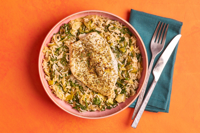 This dish just ouzos deliciousness! Chicken breasts are butterflied, smothered in oregano and lemon zest and baked to perfection while onions and leeks sizzle in aromatic garlic and sun-dried tomato pastes. In go spinach, dill and mint, fragrant rice and thick Greek-style yogurt and there you have it!