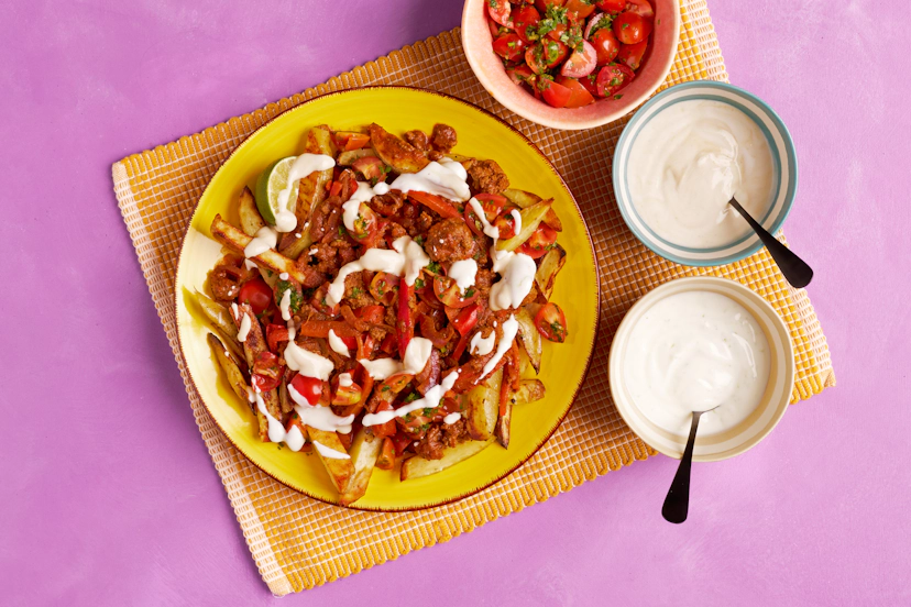 Make midweek a culinary peak with fiesta flavours! Bake (or air-fry) thin potato fries until golden, while you sizzle onions, peppers and beef mince. Our easy peasy garlic paste and Mexican spice mix add flavour oomph, so a short simmer in tomato sauce finishes that beautiful beef base. Throw together a zesty tomato salsa, lime dressing and miso drizzle, so you can load those fries and feast on!