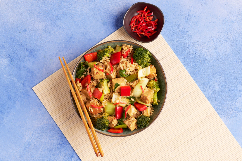 Hunky chunks of tempeh are the perfect match for teriyaki sauce – and this one's whipped up in minutes from garlic, ginger, chilli, tamari and oyster sauce. Stir-fried spring onions, broccoli, peppers and pak choi get in on the action, stirred through filling brown rice with a final flourish of red chilli.