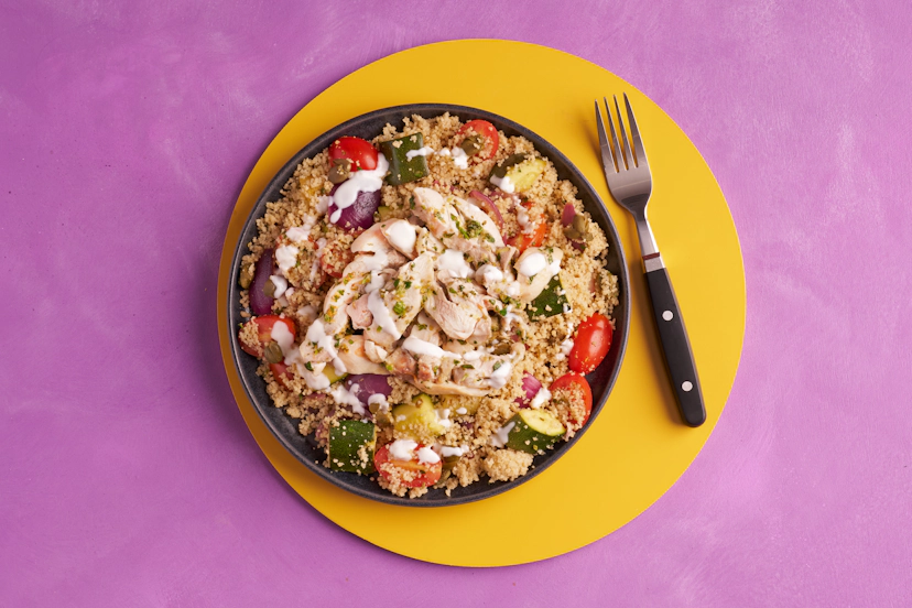 These juicy grilled chicken thighs are living their zest life. They’re served on a satisfying bed of couscous packed with baby tomatoes, sautéed courgettes, red onions and capers – all elevated with the same lemony, garlicky herb dressing that makes the chicken zing. A drizzle of Greek-style yogurt seals the deal.