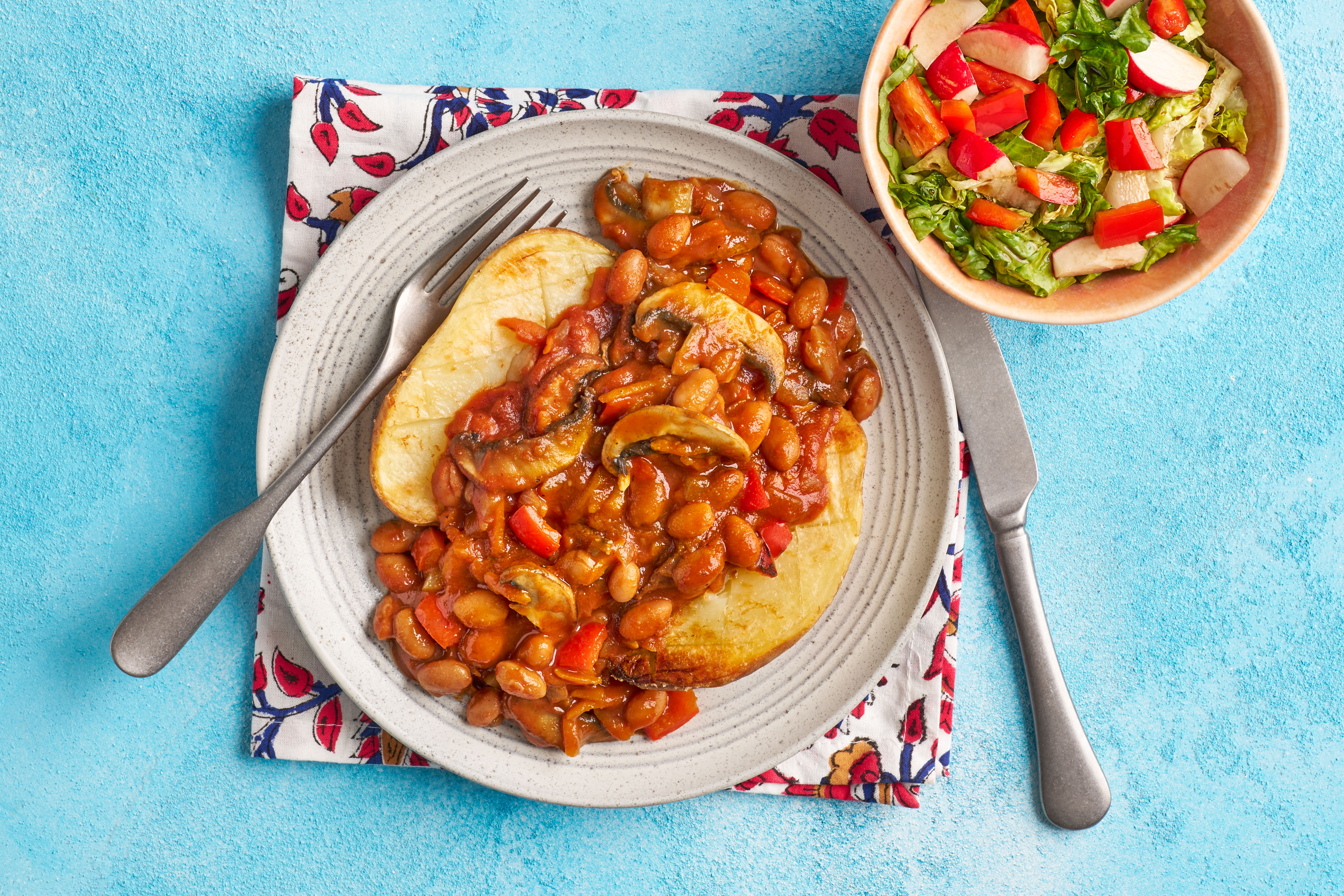Loaded jackets with curry-spiced beans & mushrooms